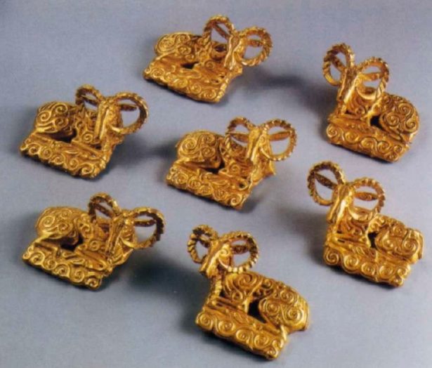 Семь накладок в виде фигуры архара. IV век до н. э.. Золото. В среднем 8 х 6 см.